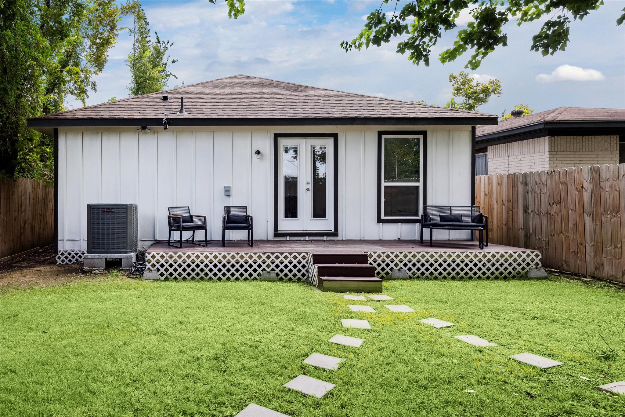 2631 Stevens Street Houston, TX 77026 - Photo 21 of 25 The fenced backyard features a deck with French door access, offering the perfect spot for outdoor seating or weekend gatherings. A private green space provides plenty of room for relaxation or play.”