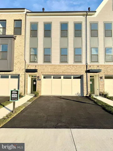 a front view of a building with a street