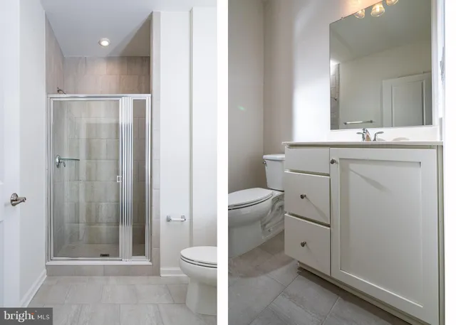 a bathroom with a toilet sink and shower