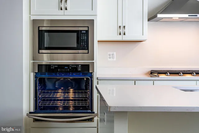 a kitchen with a stove and a microwave