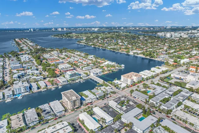 a utility room with a refrigerator a washer and dryer