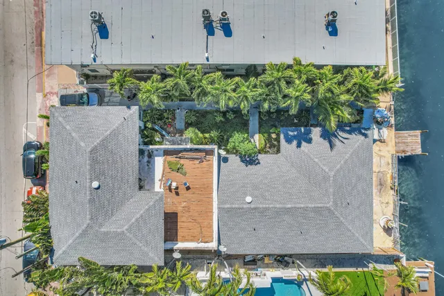 a bathroom with a sink a mirror a bathtub and shower