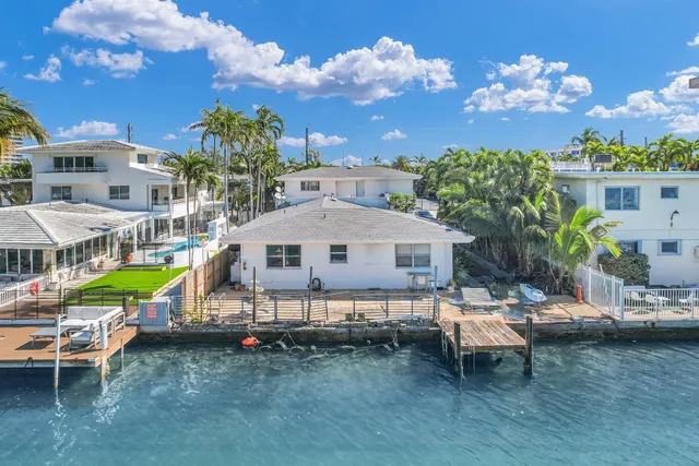 a kitchen with stainless steel appliances granite countertop a refrigerator and a stove