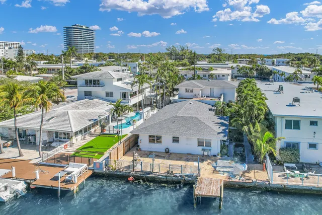 a living room with lots of furniture and white walls