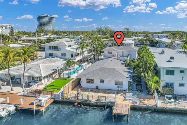 a room with furniture a chandelier and a window