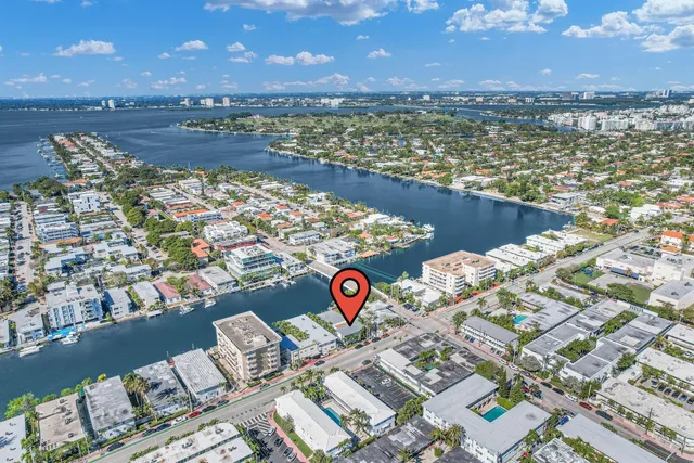 a view of a dining room with furniture and a window
