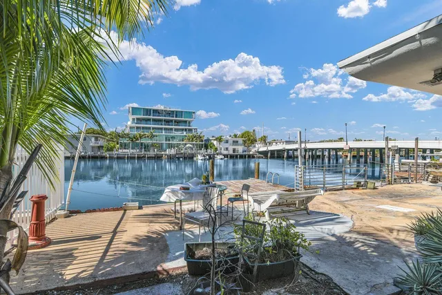 a living room with a flat screen tv and a fireplace