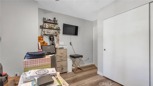 a view of entryway with workspace and wooden floor