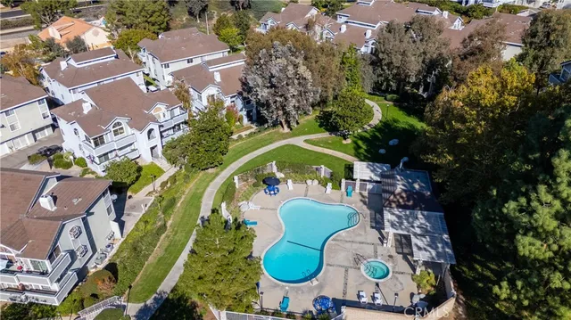 an aerial view of a swimming pool patio and mountain view