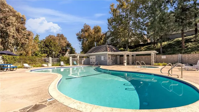 a view of a swimming pool with a patio
