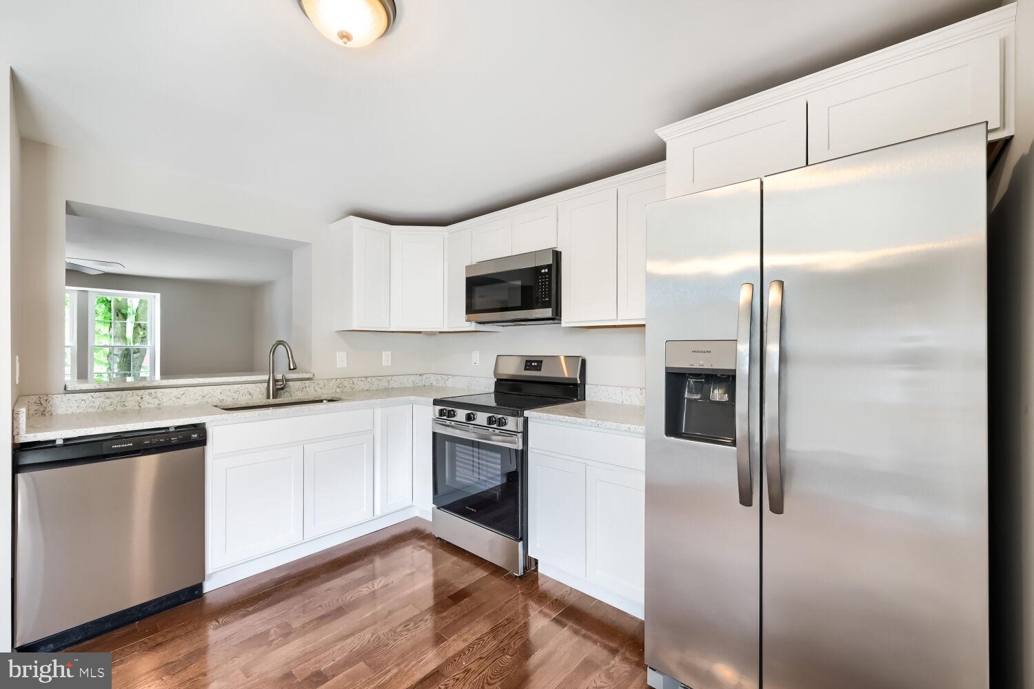 2254 Riding Crop Way Windsor Mill, MD 21244 - Photo 9 of 29 Modern kitchen with sleek finishes.