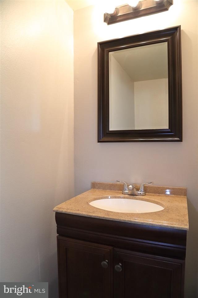 924 Hanover Road York, PA 17408 - Photo 2 of 20 a bathroom with a sink and a mirror