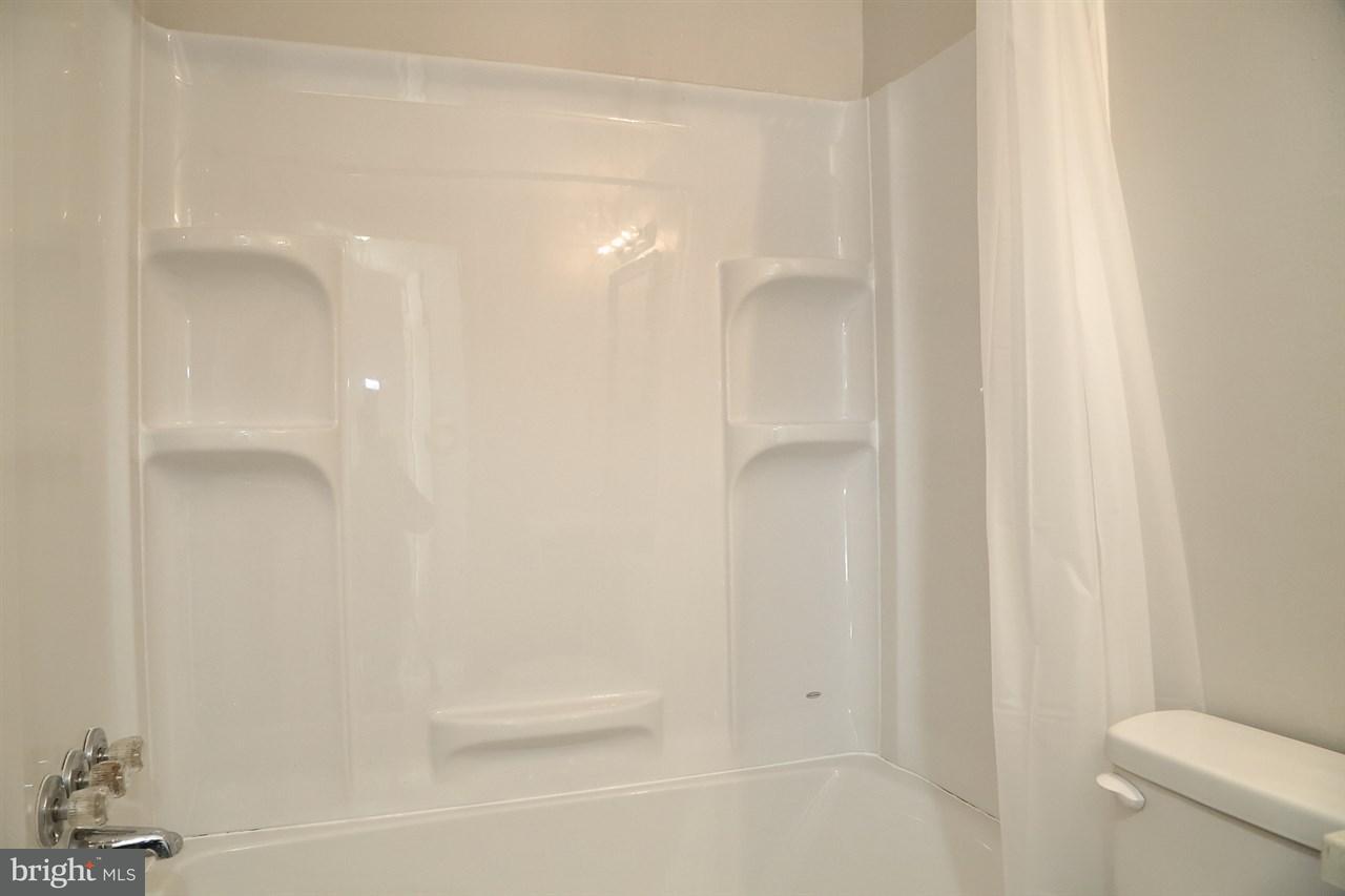 924 Hanover Road York, PA 17408 - Photo 17 of 20 a bathroom with a shower and a toilet