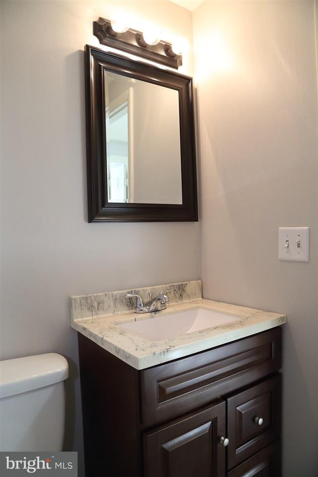 924 Hanover Road York, PA 17408 - Photo 18 of 20 a bathroom with a sink a toilet and mirror