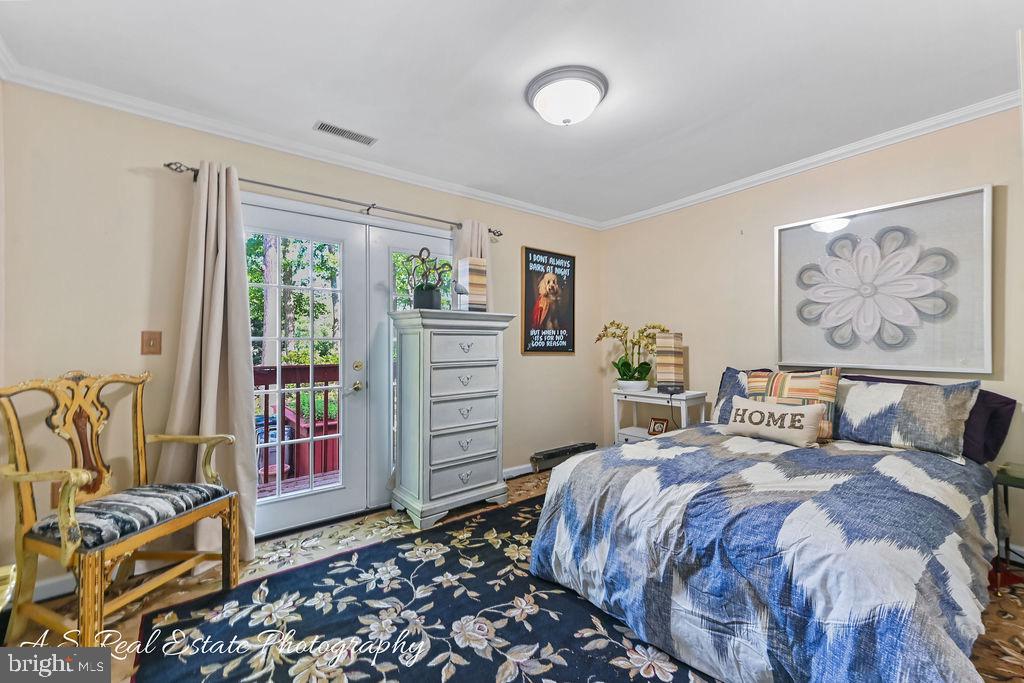 122 Sandyhook Road Ocean Pines, MD 21811 - Photo 15 of 16 a bedroom with bed and wooden floor