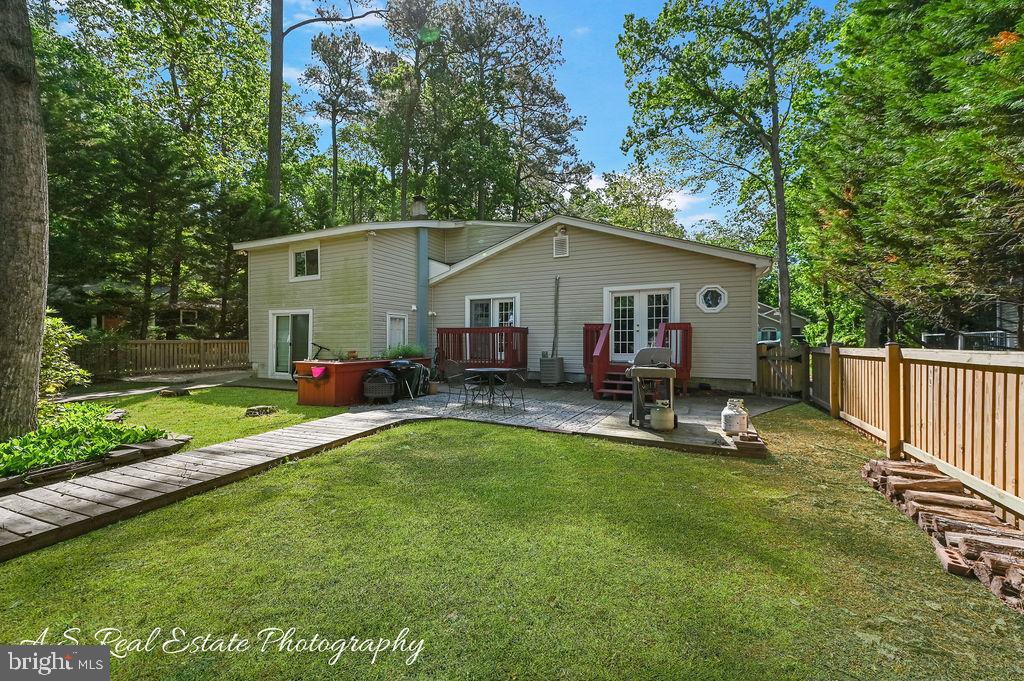 122 Sandyhook Road Ocean Pines, MD 21811 - Photo 2 of 16 a view of a house with a yard and sitting area