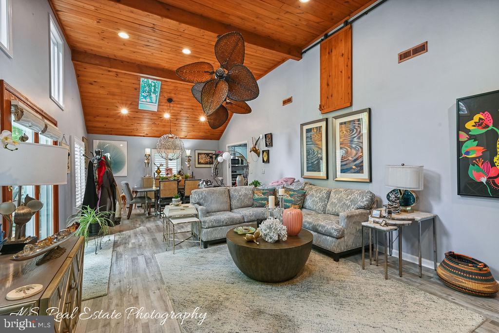 122 Sandyhook Road Ocean Pines, MD 21811 - Photo 7 of 16 a living room with furniture and a flat screen tv