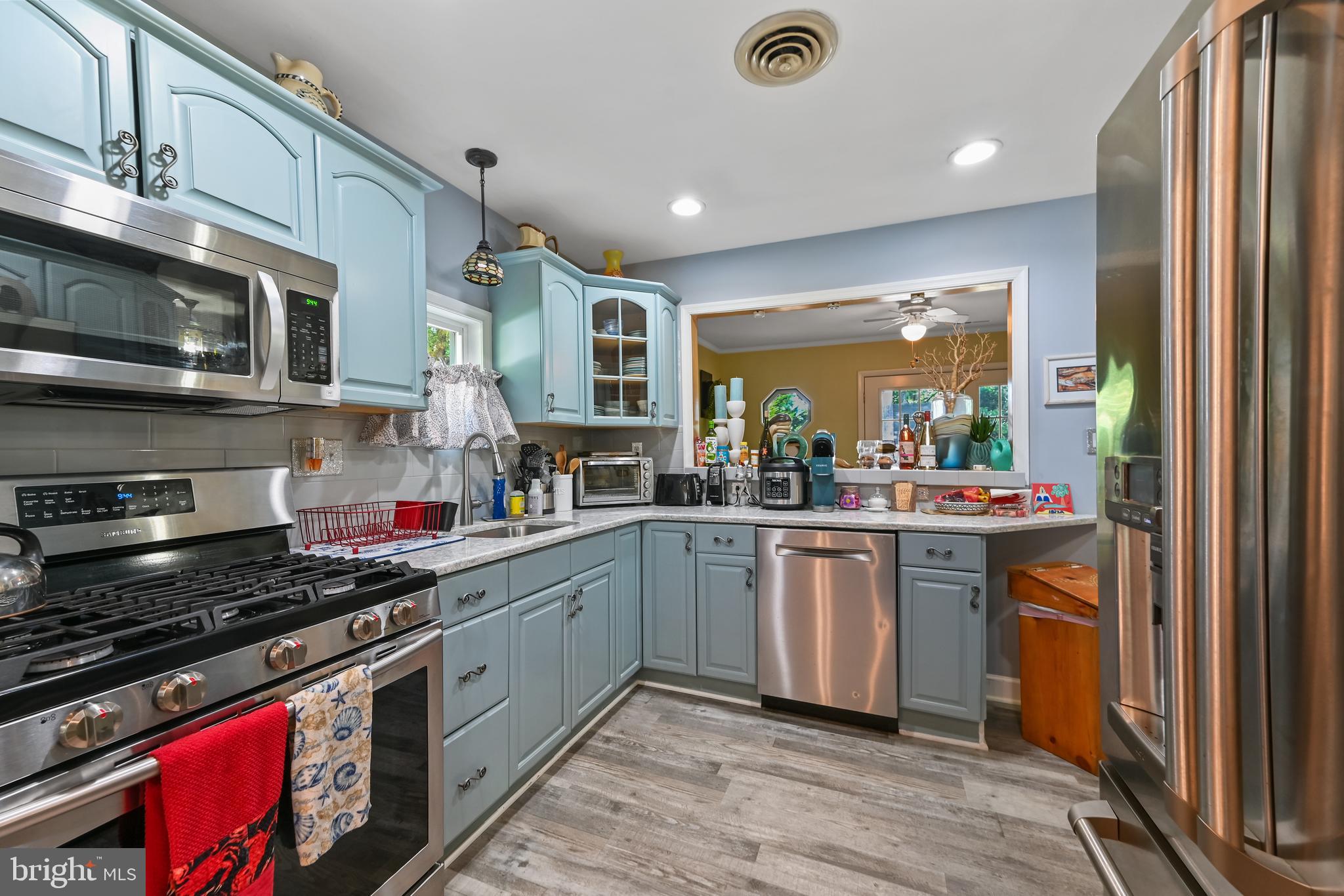 122 Sandyhook Road Ocean Pines, MD 21811 - Photo 10 of 16 a kitchen with stainless steel appliances granite countertop a stove and a sink