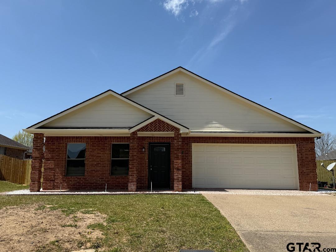 553 Princess Place Tyler, TX 75704 - Photo 2 of 32 a front view of a house with a yard
