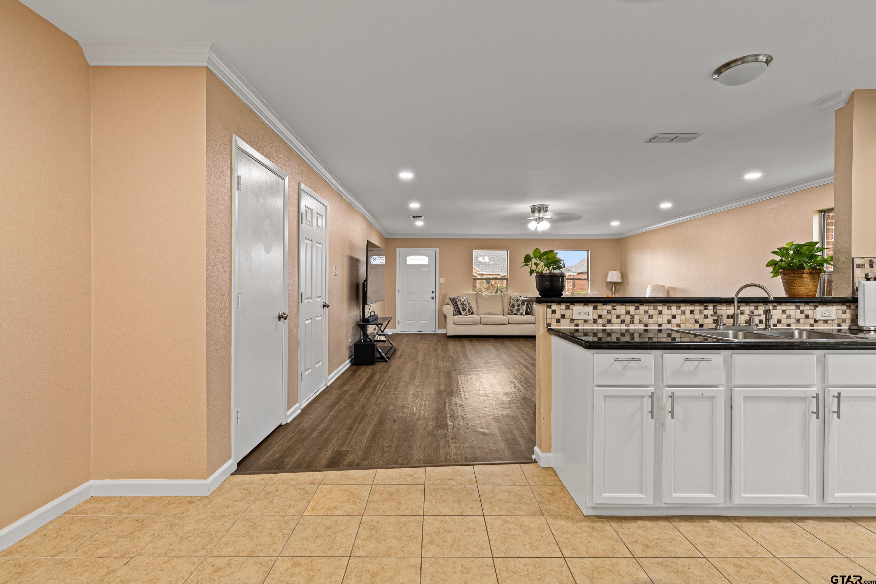 553 Princess Place Tyler, TX 75704 - Photo 21 of 32 a view of a hallway with wooden floor