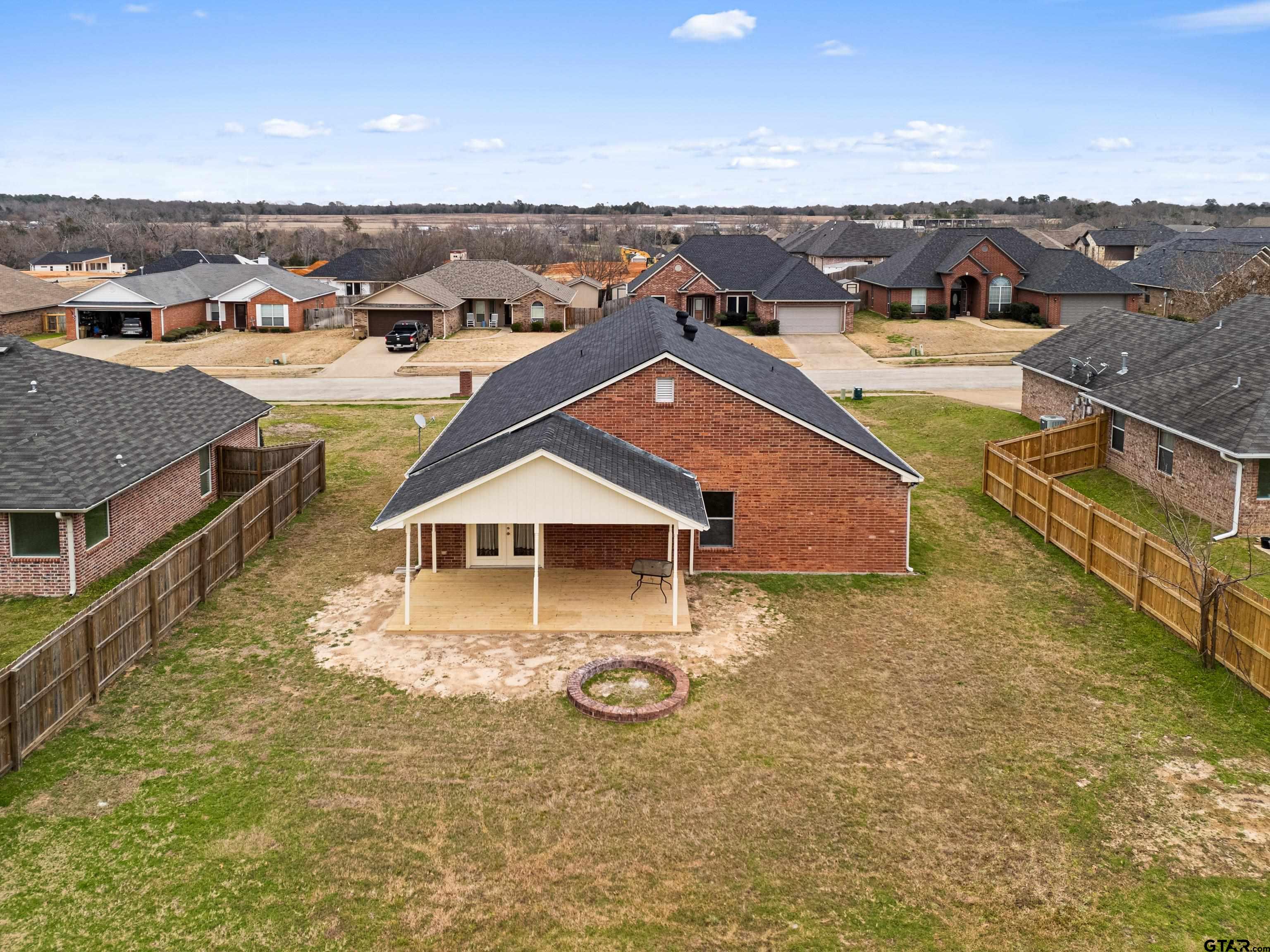 553 Princess Place Tyler, TX 75704 - Photo 32 of 32 an aerial view of residential houses with outdoor space