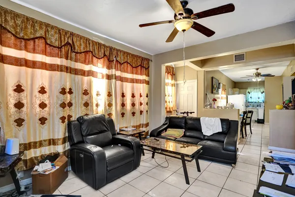 a living room with furniture and a window