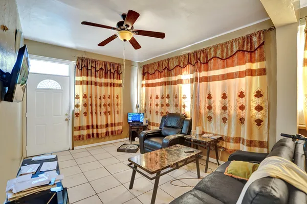 a living room with furniture and a large window