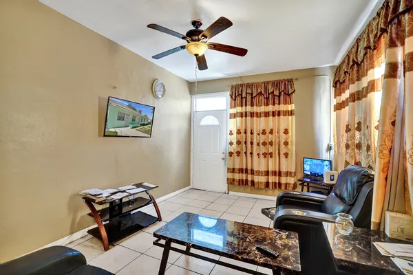 a living room with furniture and a window