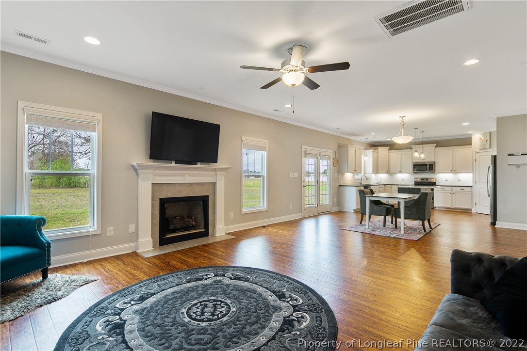 5213 Bree Bridge Road Hope Mills, NC 28348 - Photo 13 of 50 a living room with furniture and a fireplace