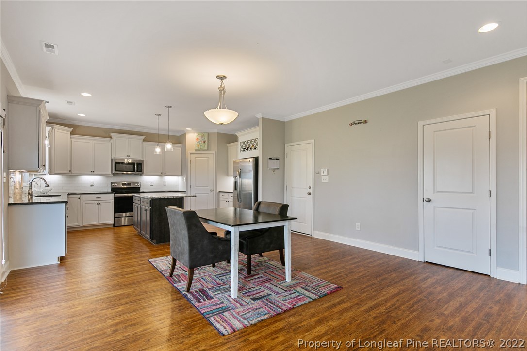5213 Bree Bridge Road Hope Mills, NC 28348 - Photo 15 of 50 a view of a kitchen and dining room