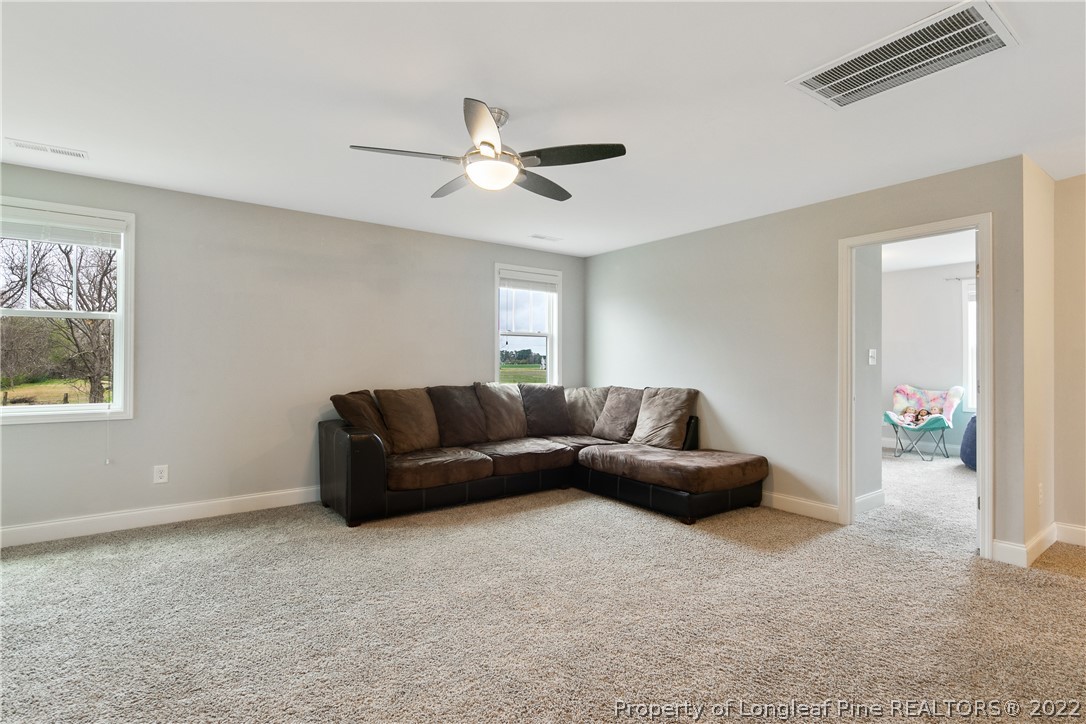5213 Bree Bridge Road Hope Mills, NC 28348 - Photo 23 of 50 a living room with furniture and a window