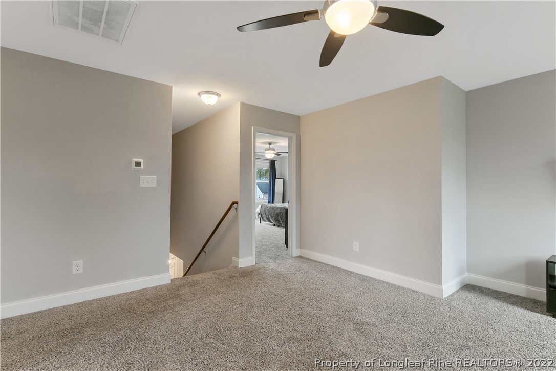 5213 Bree Bridge Road Hope Mills, NC 28348 - Photo 25 of 50 a view of empty room with a ceiling fan