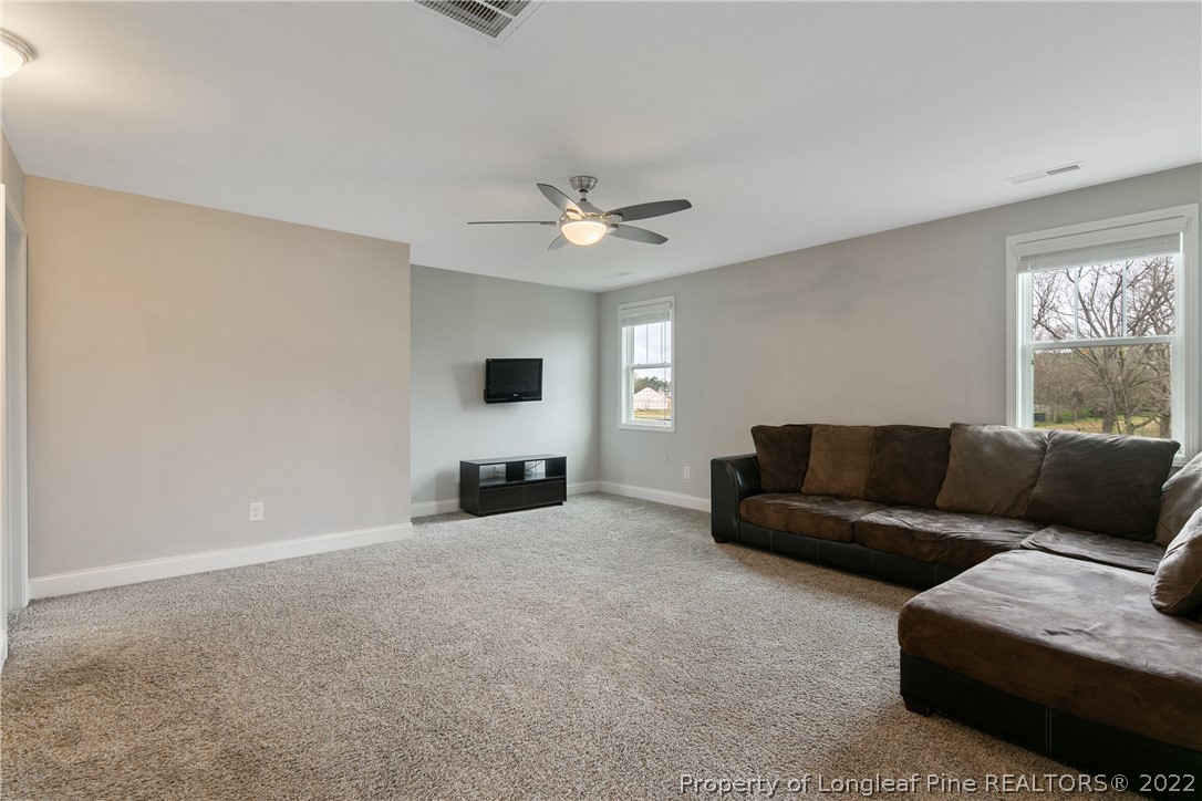 5213 Bree Bridge Road Hope Mills, NC 28348 - Photo 26 of 50 a living room with furniture and a large window