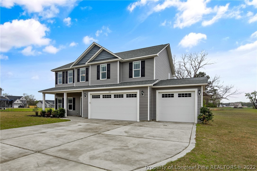 5213 Bree Bridge Road Hope Mills, NC 28348 - Photo 3 of 50 a view of a house with a yard