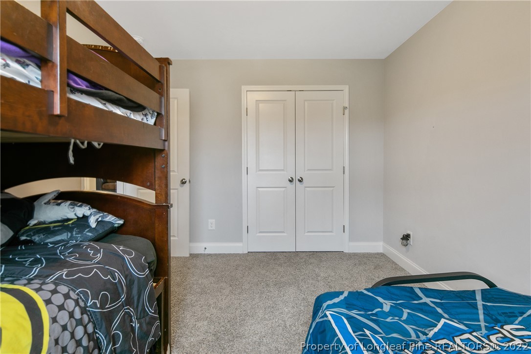 5213 Bree Bridge Road Hope Mills, NC 28348 - Photo 43 of 50 a bedroom with a bed and a window