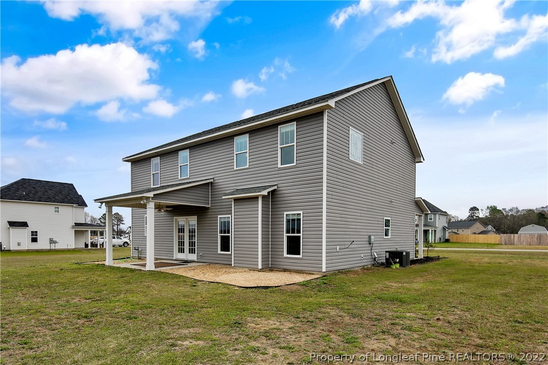 5213 Bree Bridge Road Hope Mills, NC 28348 - Photo 49 of 50 a front view of a house with a yard