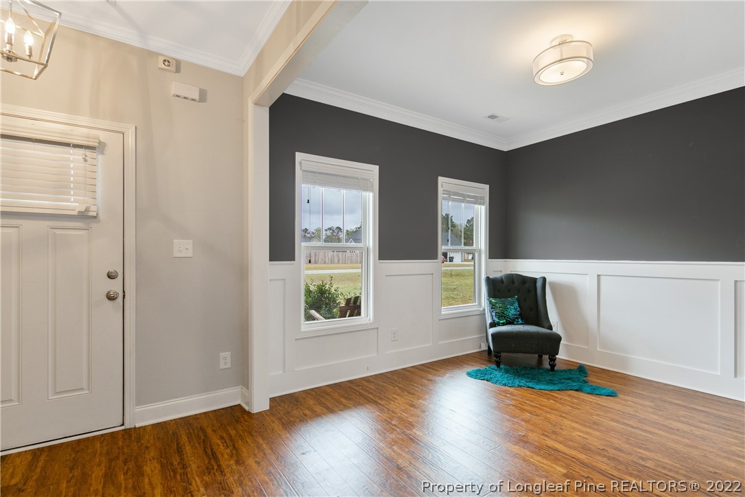 5213 Bree Bridge Road Hope Mills, NC 28348 - Photo 7 of 50 a view of empty room with wooden floor and fan