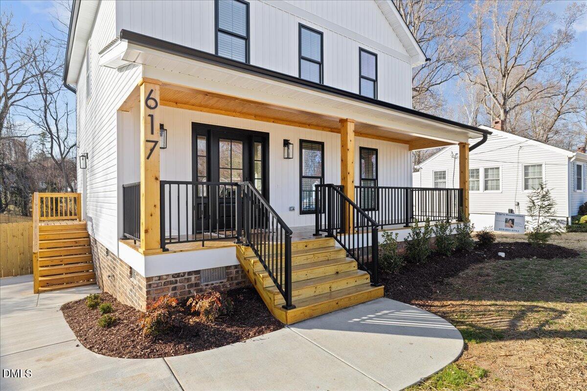 617 North 3rd Street Mebane, NC 27302 - Photo 6 of 50 a view of a house with wooden floor and floor to ceiling windows