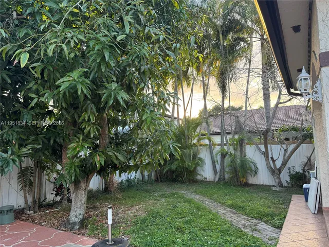 a backyard of a house with lots of green space