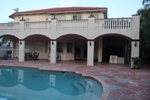 a view of building with a swimming pool