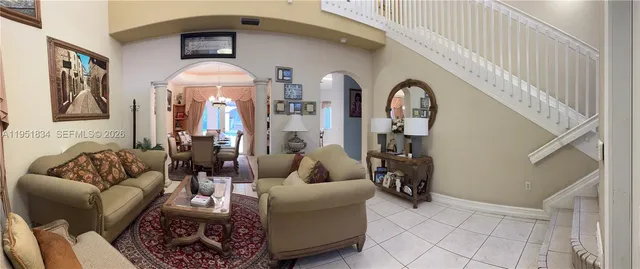 a living room with furniture and a large window