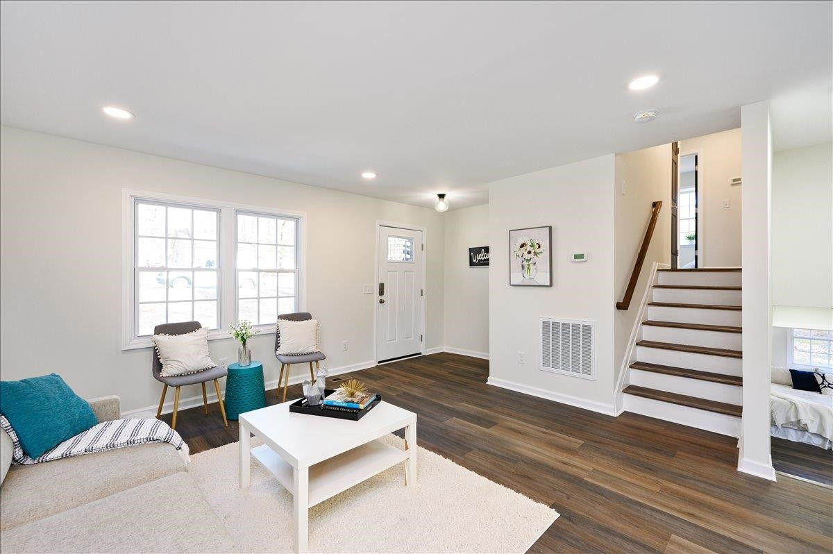 5506 McCormick Road Durham, NC 27713 - Photo 11 of 28 a living room with furniture and wooden floor