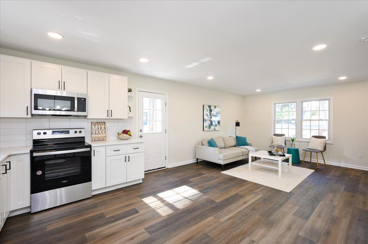 5506 McCormick Road Durham, NC 27713 - Photo 14 of 28 a living room with furniture or kitchen and a wooden floor