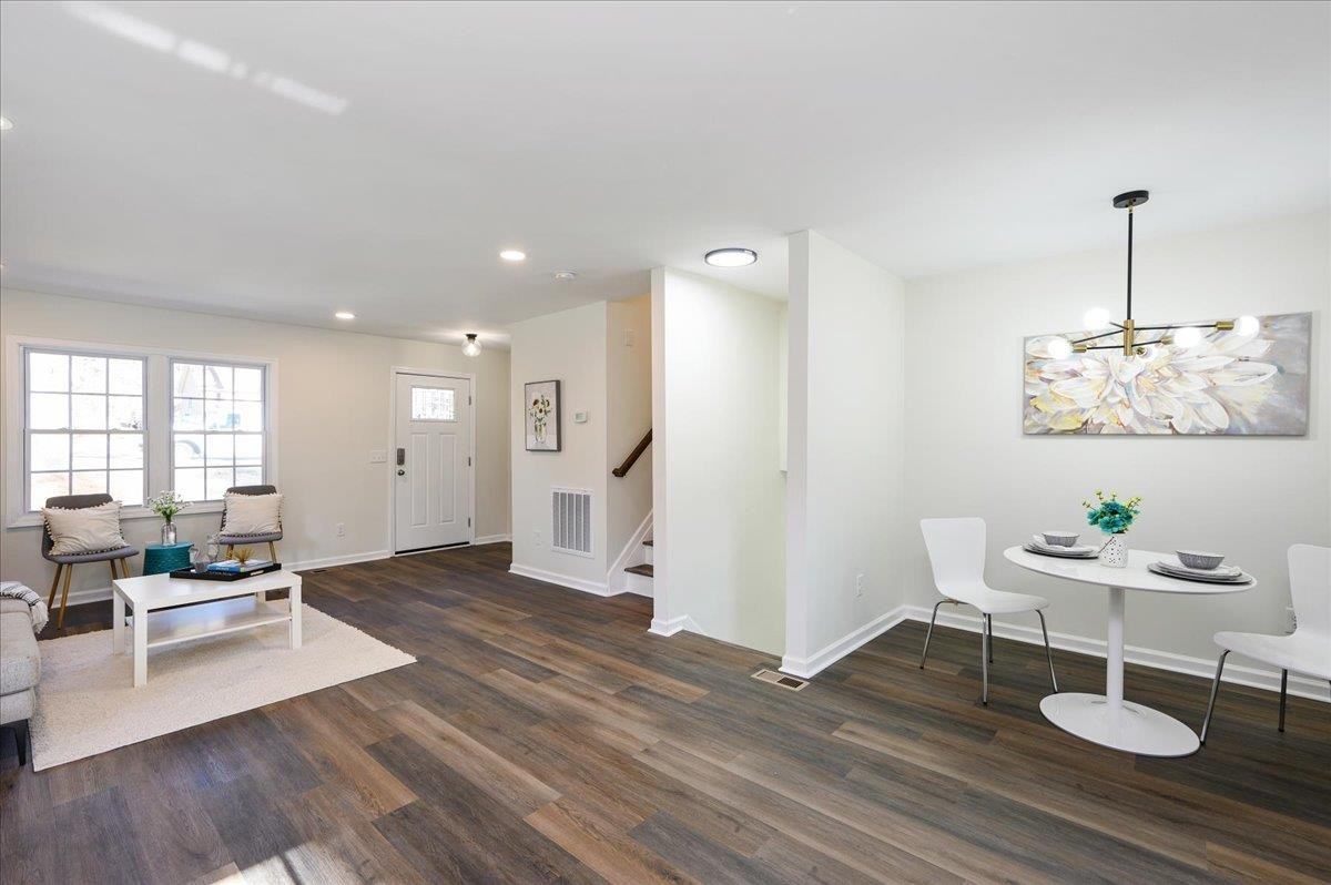 5506 McCormick Road Durham, NC 27713 - Photo 15 of 28 a living room with furniture and a wooden floor