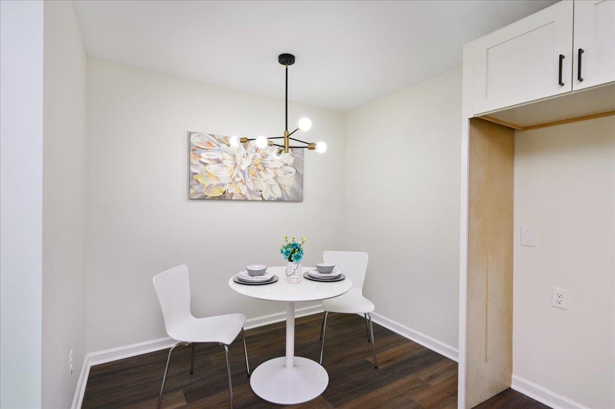 5506 McCormick Road Durham, NC 27713 - Photo 16 of 28 a view of a workspace with furniture and wooden floor
