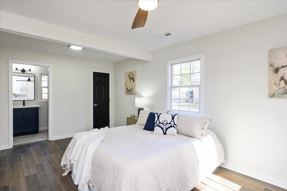 5506 McCormick Road Durham, NC 27713 - Photo 17 of 28 a bedroom with a large bed and a window