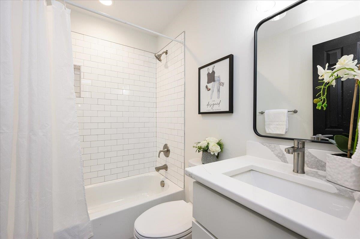 5506 McCormick Road Durham, NC 27713 - Photo 28 of 28 a bathroom with a sink toilet and shower