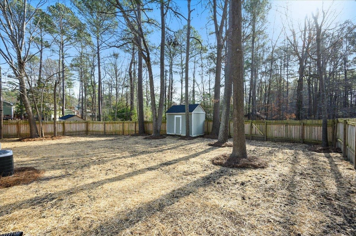 5506 McCormick Road Durham, NC 27713 - Photo 4 of 28 a backyard of a house with lots of green space