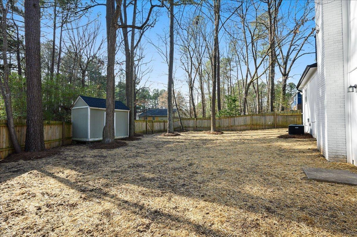 5506 McCormick Road Durham, NC 27713 - Photo 5 of 28 a view of a backyard with large trees