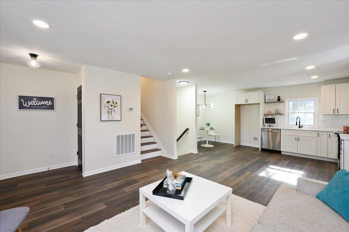 5506 McCormick Road Durham, NC 27713 - Photo 9 of 28 a living room with furniture and a wooden floor